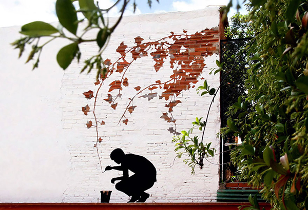 Spanish artist Pejac spreads poetic street art around European cities