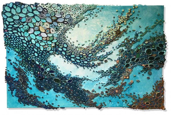 Swirling ocean reefs created from vibrant rolls of paper
