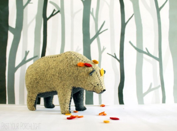 Bears that carry tiny worlds on their shoulders created by Jessie Cunningham