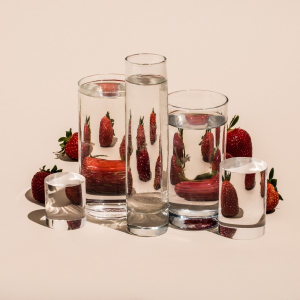 Foods distorted through liquid and glass, photography by Suzanne Saroff