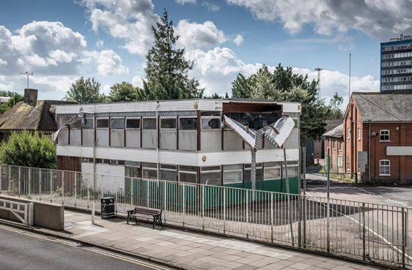 Alex Chinneck Unzips The Walls of a derelict office building