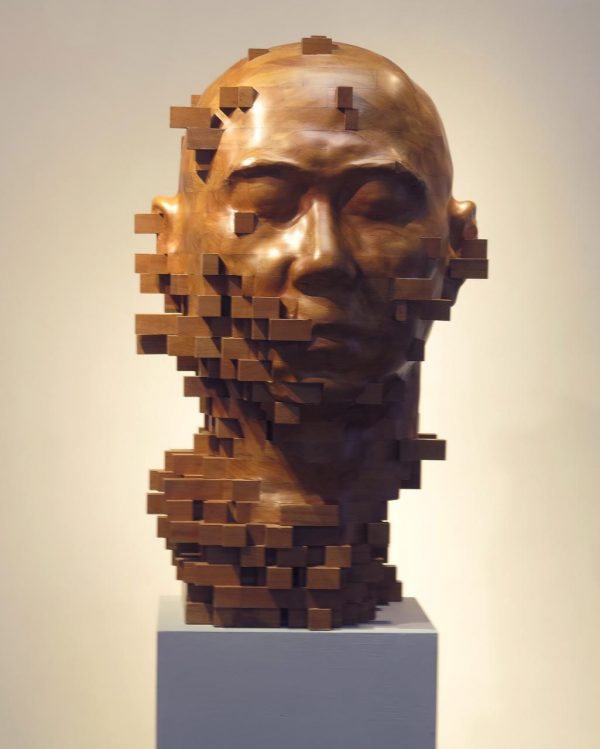 Pixelated cubes, figurative wooden sculptures by Han Hsu-Tung