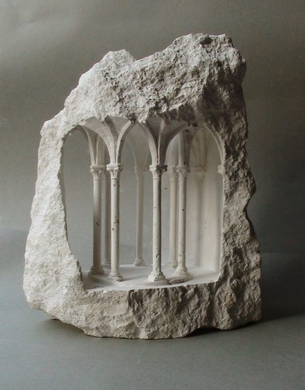 Miniature architectural structures carved into raw stone by Matthew Simmonds