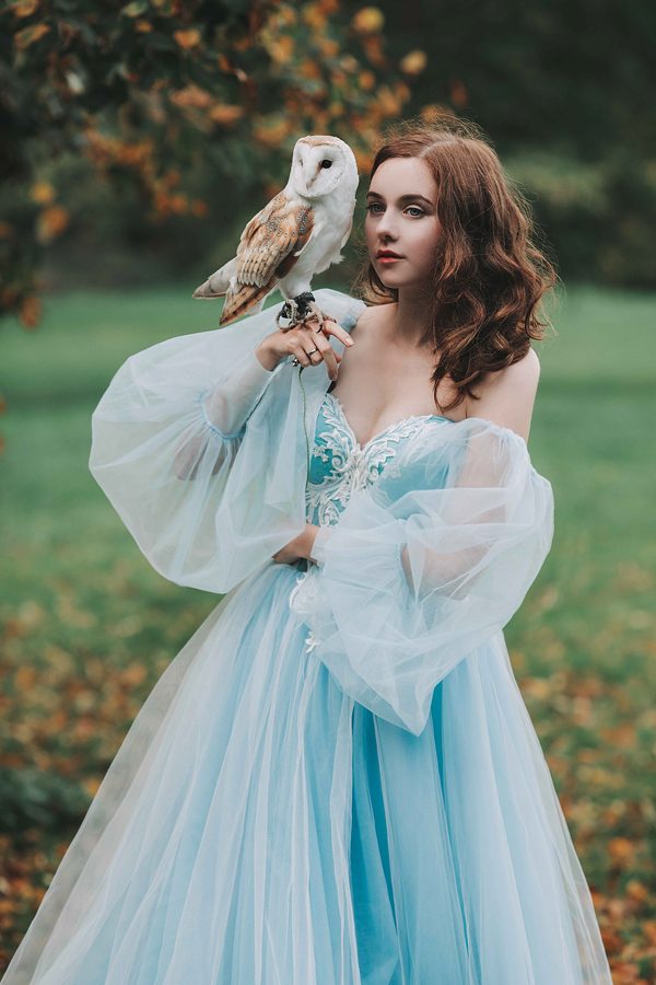 Girl in a blue dress and owl, photography by Jovana Rikalo