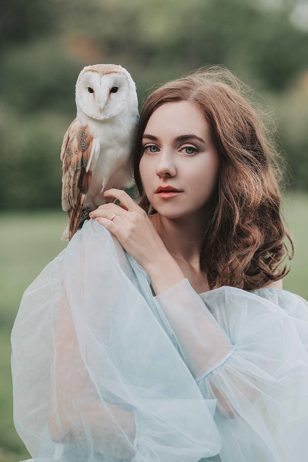 Girl in a blue dress and owl, photography by Jovana Rikalo